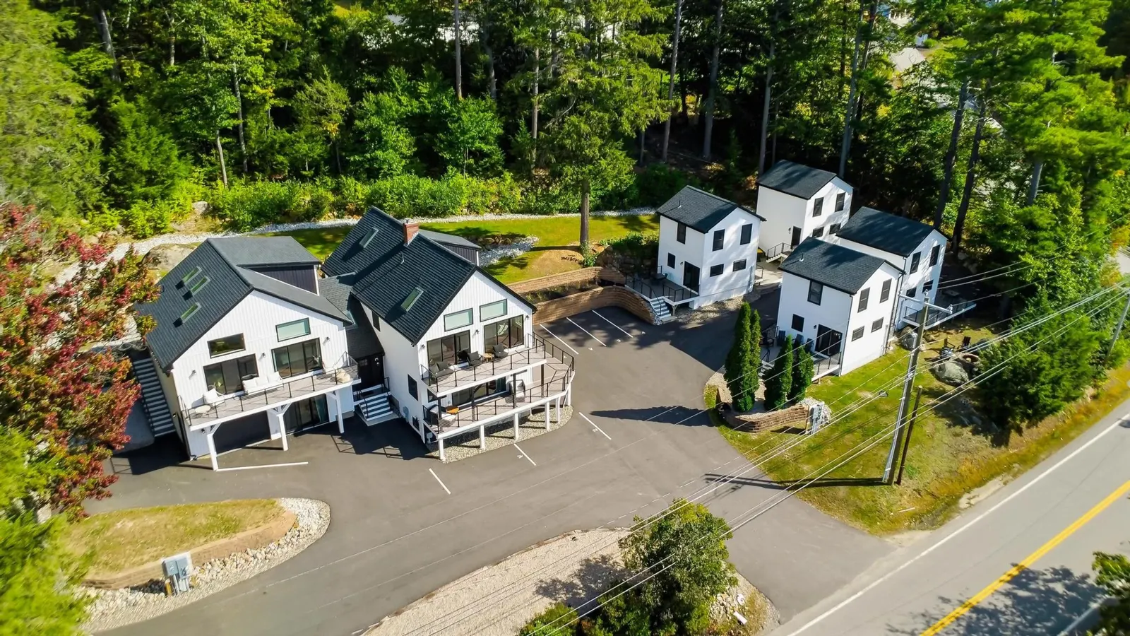 Clear aerial view of the two homes and four cottages at Bully’s Bay